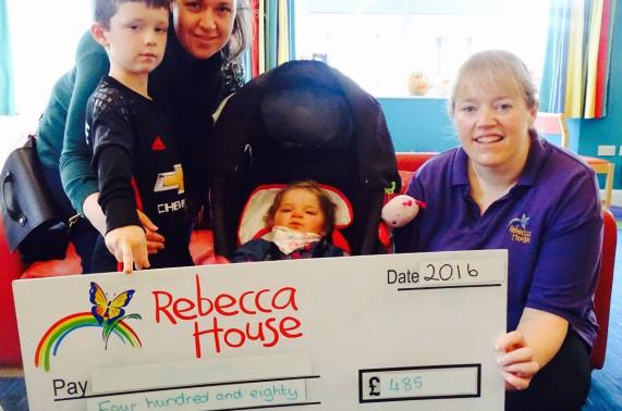 Historical photo of the Rebecca House team and children