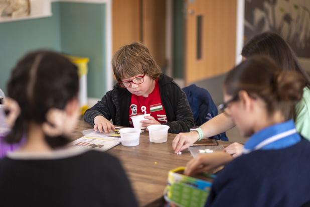 Rebecca House child doing crafting activities