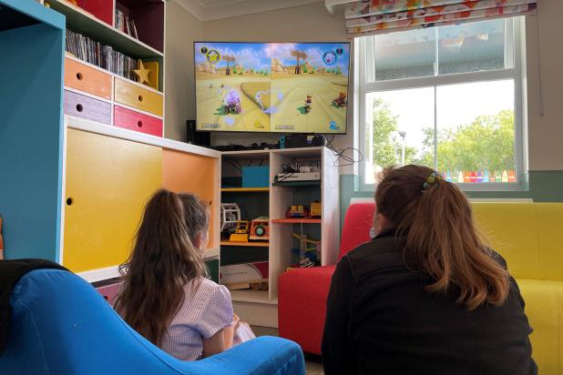 Rebecca House child and staff member playing computer games