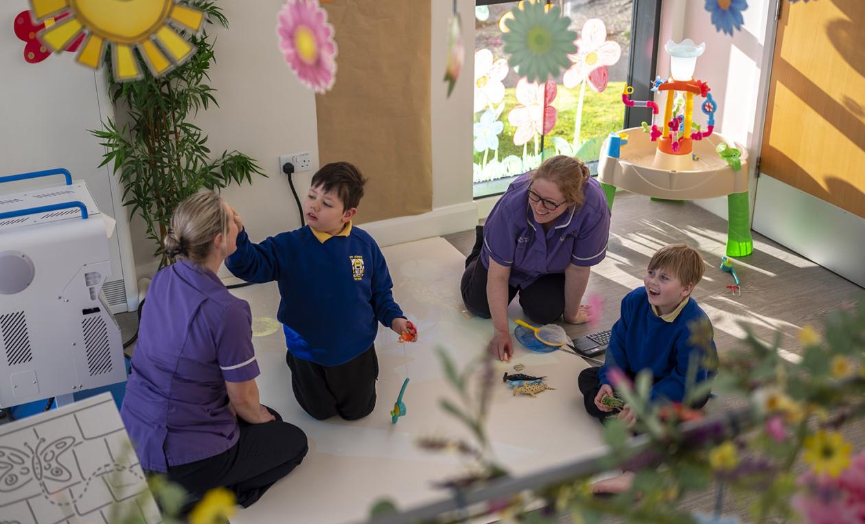 Rebecca House nurses playing with children