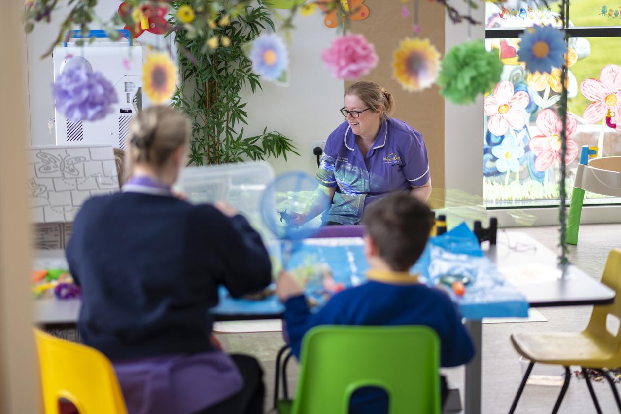 Rebecca House nurse crafting with child