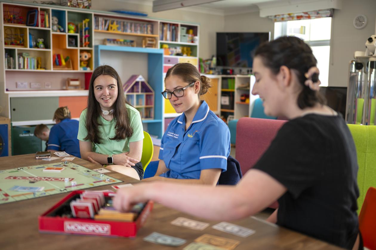 Rebecca House nurse and children playing board games